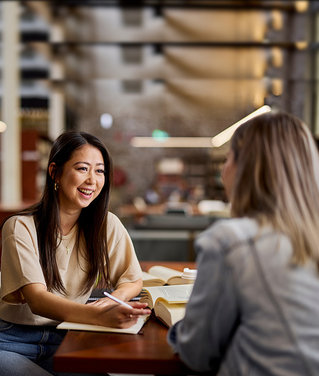 Notre Dame undergraduate female students studying together in the library